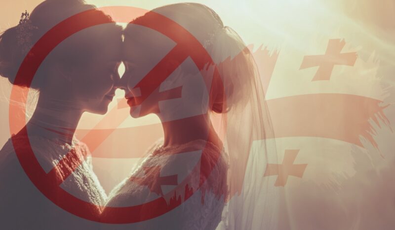Two women in wedding attire with a prohibition symbol overlayed, set against the Georgian flag backdrop